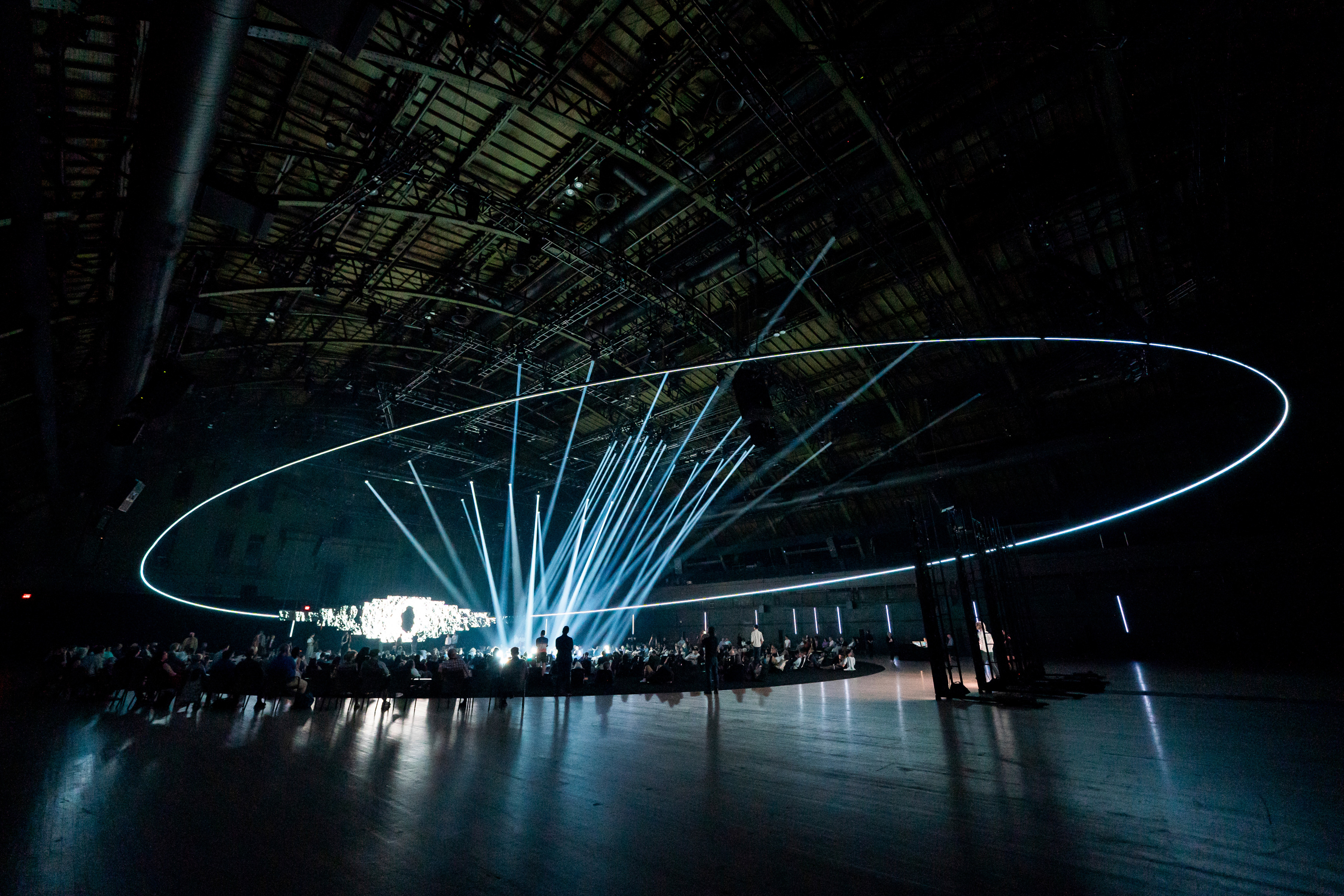 Dramatic theatrical lighting illuminates a past performance of Karlheinz Stockhausen's "Inside Light" in the Drill Hall.